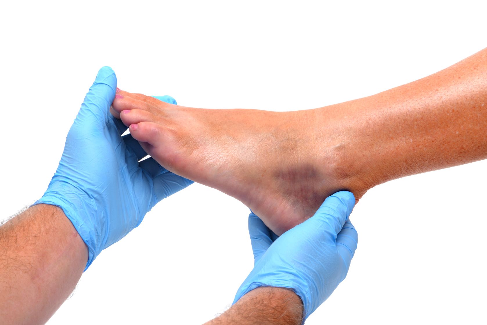 Podiatrist examining a patient foot at Lighthouse Foot and Ankle Center near Portland, Maine