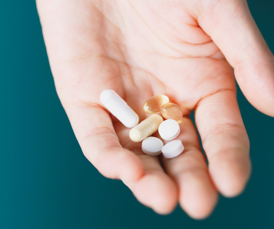 Variety of Supplements in someone's hand
