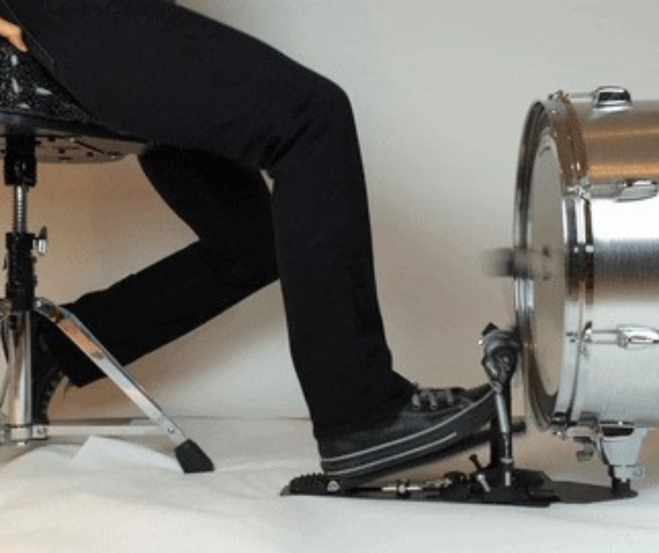 Person's foot hitting pedal for kick drum